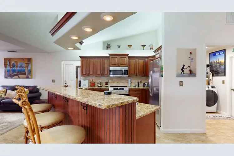 Energy-Efficient Tropical Home with Solar Panels and Pool