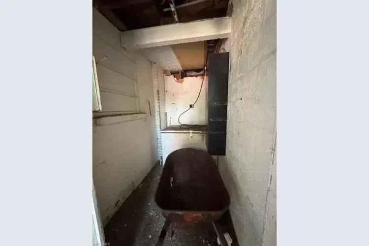 Fixer-Upper with Fireplace and Large Lot in Growing Neighborhood