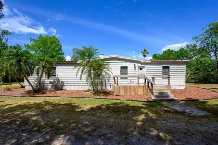 Spectacular 5-Acre Ranch Style Home with Workshop and Carport