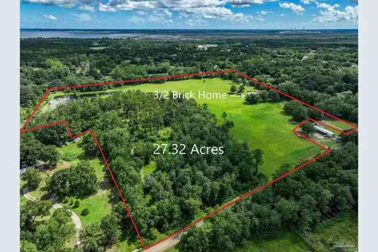 27 Acres in Pace - Country Living with City Amenities