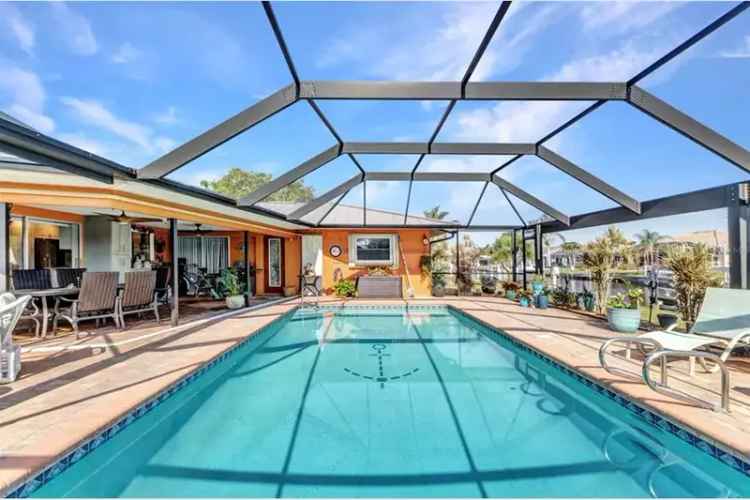 Stunning Waterfront Pool Home with Royal Palms and Hurricane Protection