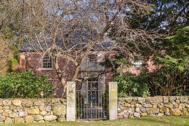 Classic Georgian Brick Home with Modern Amenities and Stunning Backyard